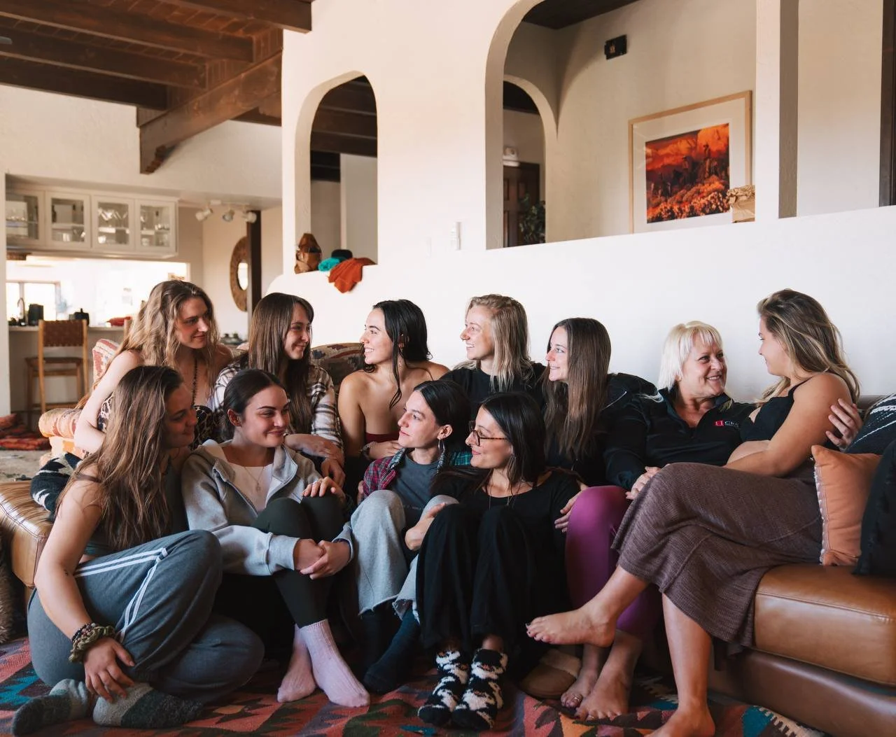 Women gathered on couches, laughing together